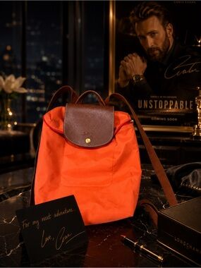 Longchamp Orange Nylon Backpack with Brown Leather Flap and Straps